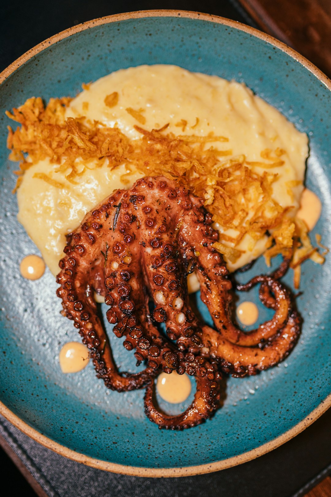 Octopus Unfurls Colorful Tentacles to Retrieve Stray Straw Piece